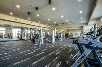 24-Hour Fitness Center with A View Of The Pool and Lake